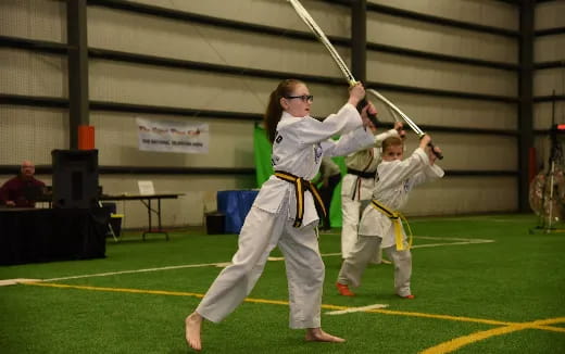 a group of people in karate uniforms