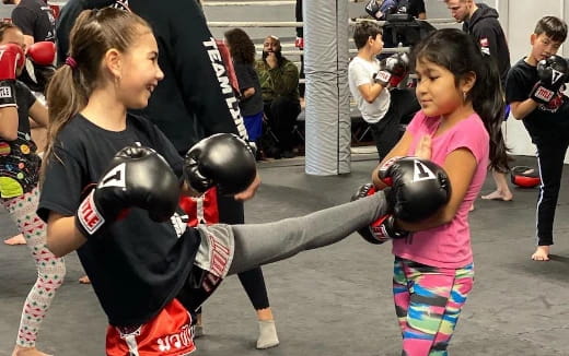 a person punching another woman