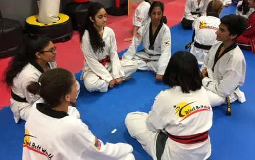 a group of people in white uniforms