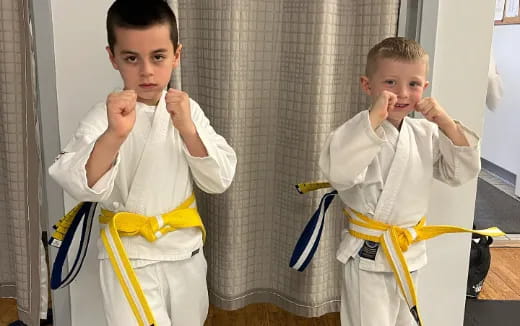 a boy wearing a karate uniform