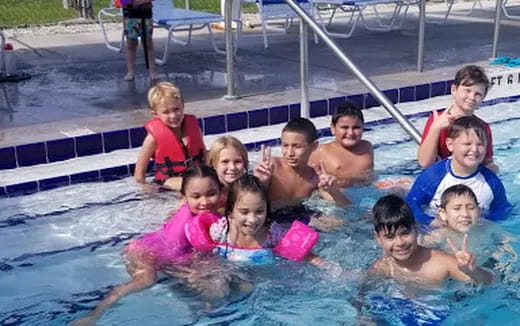 a group of people in a pool