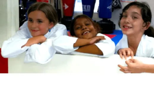 a group of children in white lab coats