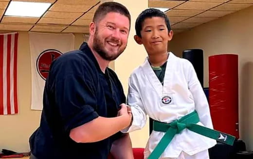 a man and a boy posing for a picture