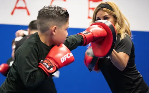 a man and woman boxing