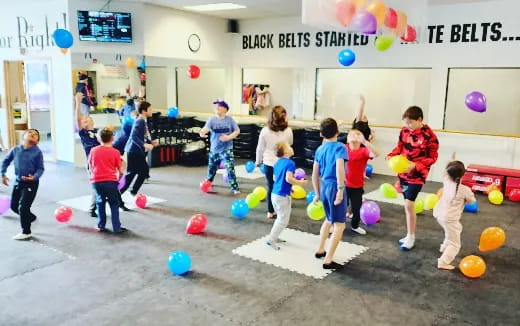 a group of children playing with balls