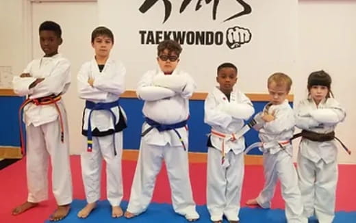 a group of people in karate uniforms