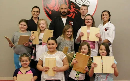 a group of people holding books