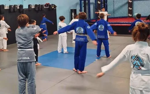 a group of people in karate uniforms