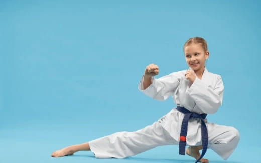 a boy in a karate uniform
