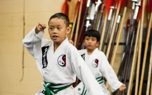 a couple of boys in white uniforms