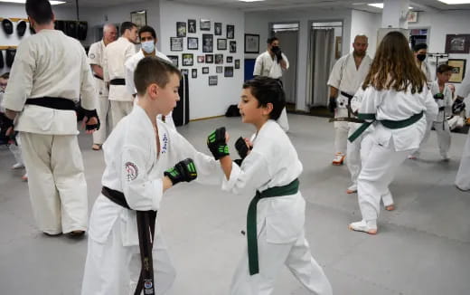 a group of people in karate uniforms