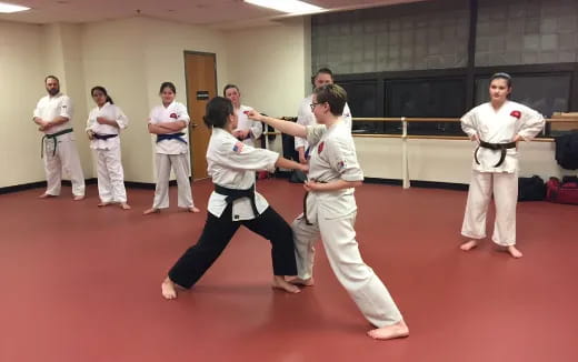 a group of people in karate uniforms