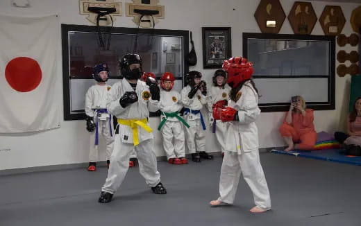 a group of people in white suits