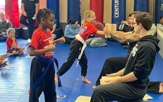 a group of people sitting on the floor