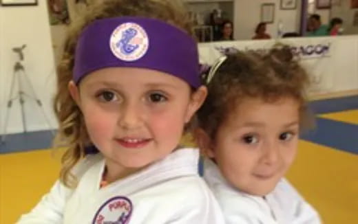 a couple of children posing for the camera