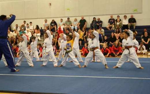 a group of people in karate uniforms