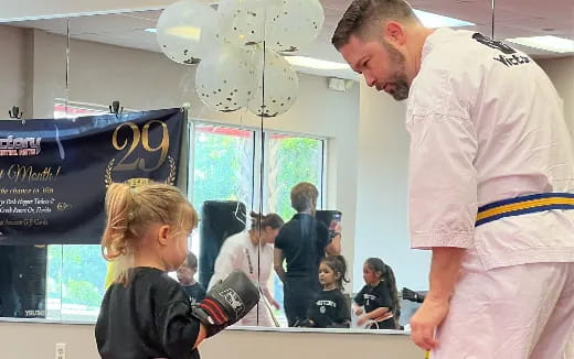 a man and a woman talking to a man in a white coat