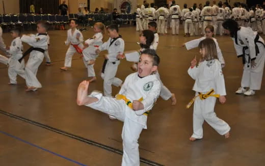 a group of people in karate uniforms