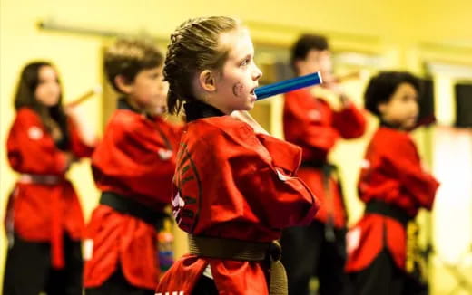 a group of people in red uniforms