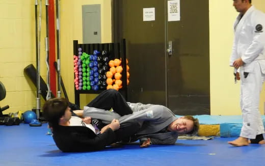 a person lying on a mat