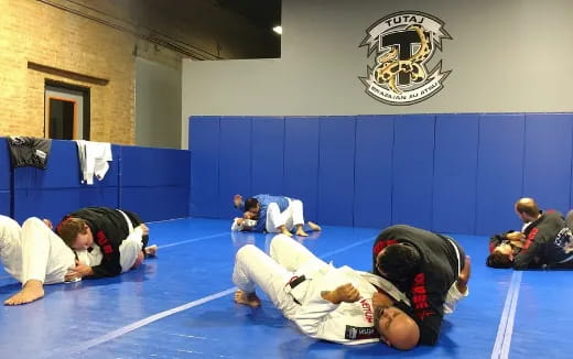 a group of people in a karate class