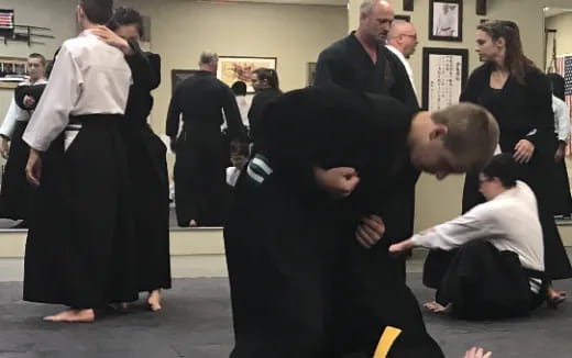 a group of people in black robes