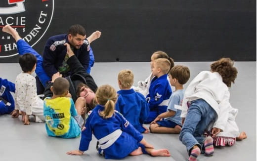 a group of children in blue uniforms