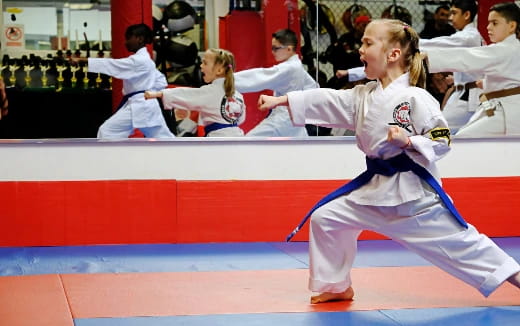 a man in a karate uniform