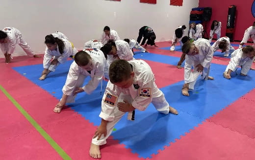 a group of people in karate uniforms