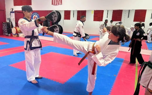 a group of people in karate uniforms