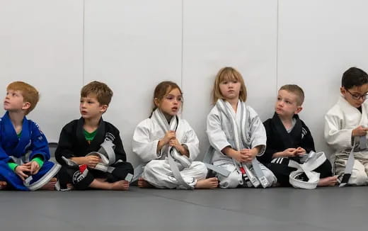 a group of children sitting on the floor