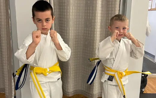 a boy wearing a karate uniform