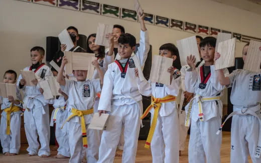 a group of people in karate uniforms