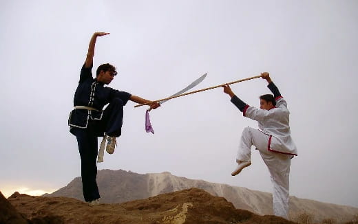 a man and a woman jumping in the air