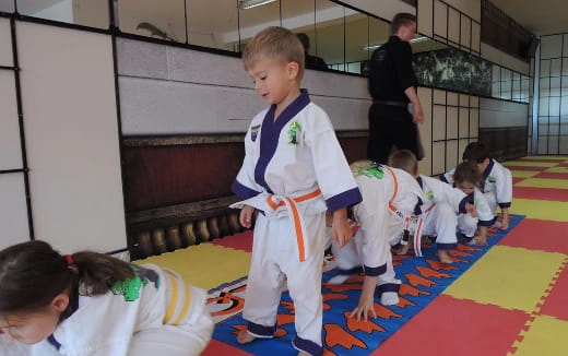 a boy in a karate uniform