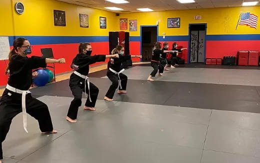 a group of people in a gym