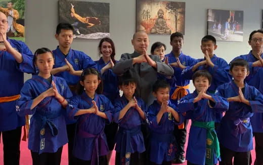 a group of children in blue robes