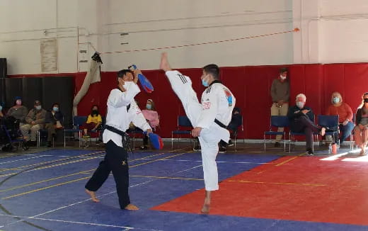 a couple of people in karate uniforms