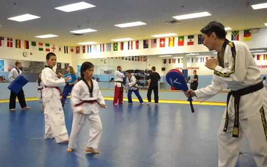 a group of people in karate uniforms