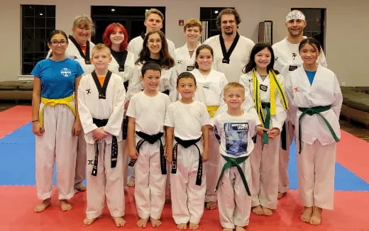 a group of people posing for a photo