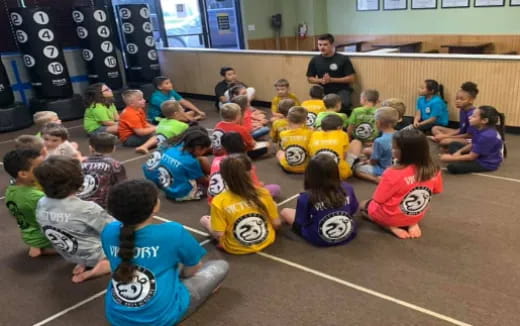 a group of children sitting on the floor