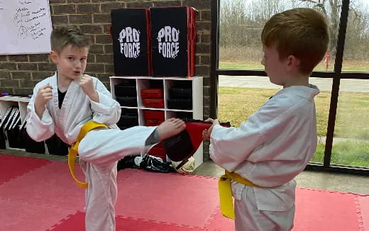 a couple of boys playing with a toy