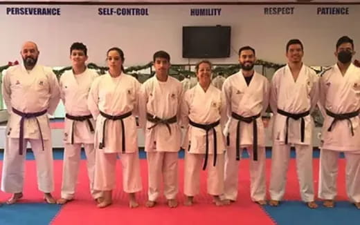 a group of men in karate uniforms