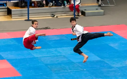 two boys in karate uniforms