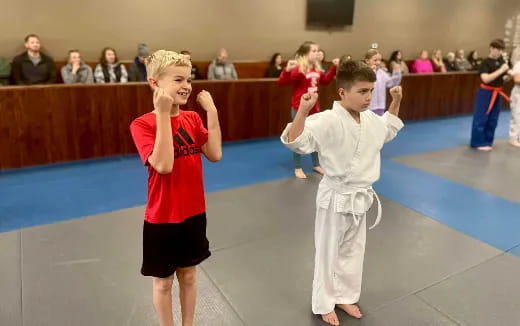 a couple of kids in a gym