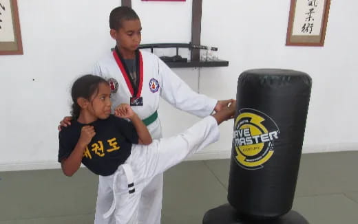 a man and a woman in karate uniforms