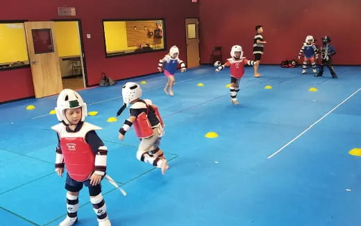 a group of kids playing a sport