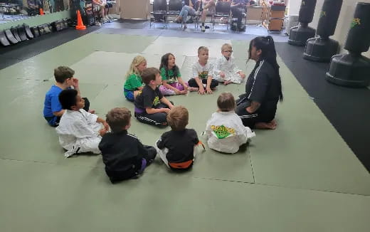 a group of people sitting on the floor