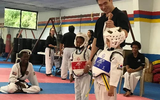 a group of people in karate uniforms