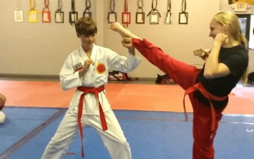 a man and woman in a karate class
